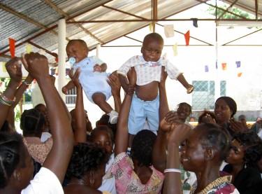 Celebrating the good health of the children at the mother-to-child HIV transmission prevention centers. Image courtesy of the Sant'Egidio community.