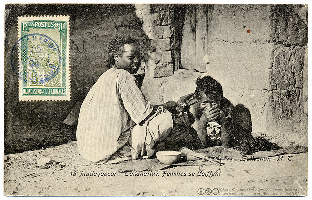 Women doing their hair- Antananarivo,&nbsp;Madagascar. Vintage photographic postcard, c.1907, photograph by Collection M. T., printed by Ateliers de Phototypie Guende, Marseille, France. Shared by postaletrice on Flickr (CC-BY-NC-3.0)